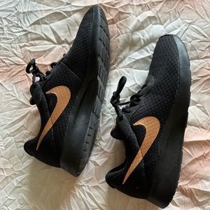 Black and rose gold Nike sneakers